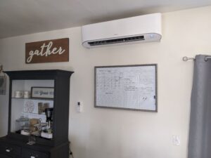 The Mini Split indoor wall-mounted air conditioner unit is mounted on the wall in the office.