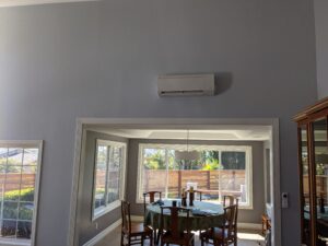 Mini Split indoor wall-mounted air conditioning unit installed above the window.