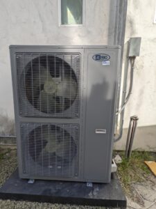 High AC with two fans, installed outside the building.