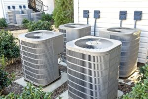 Four large central air-conditioning units installed outside the building.