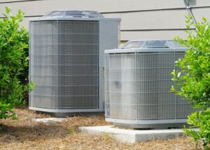 Two central air conditioning units installed near the building.